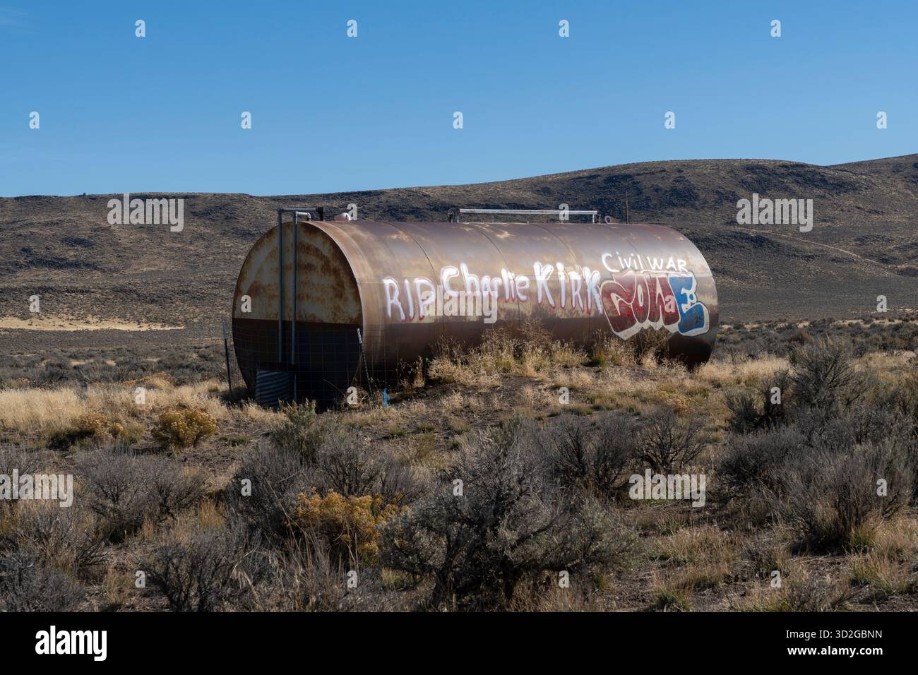 Graffiti on a storage tank reading 'RIP Charlie Kirk' in rural Lakeview County, Oregon on October 27, 2025. Stock Photo