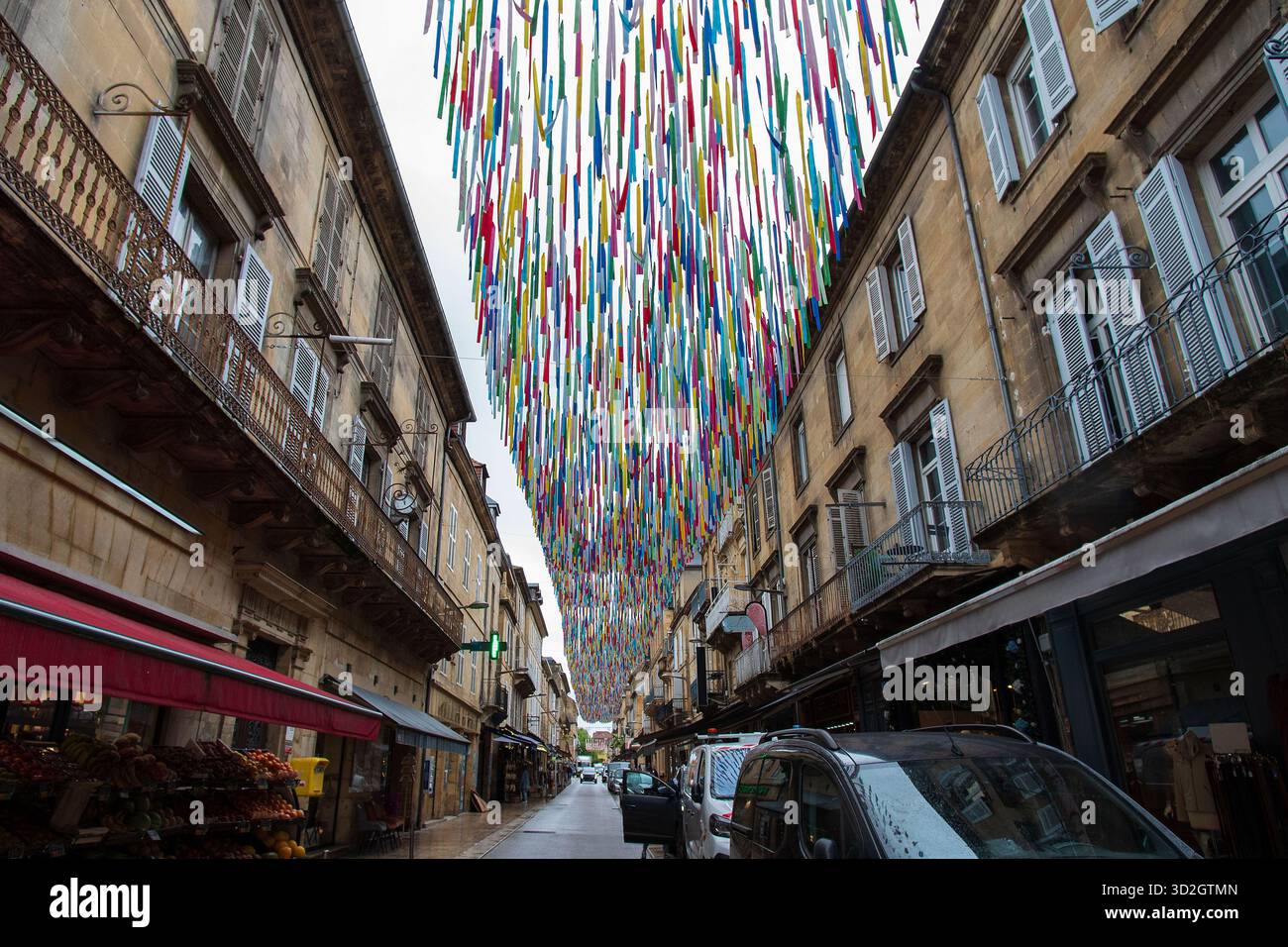 Street decorated with small flags in the town centre of Sarlat Stock Photo