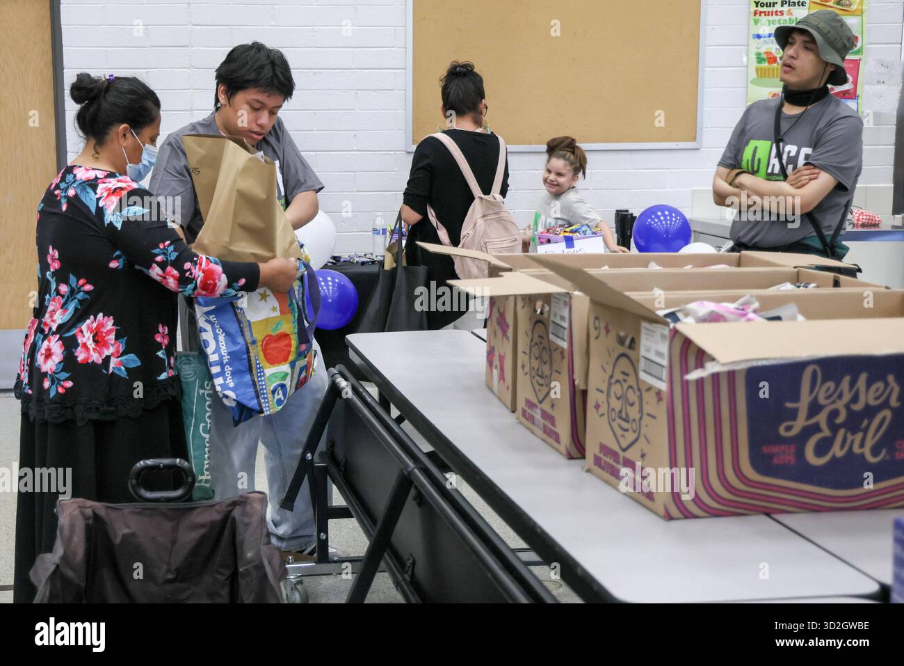 Phoenix, USA. 01st Nov, 2025. The Neighbor to Neighbor: Food for Every AZ  Family community food distribution event is held at Solano Elementary  School in Phoenix, Arizona USA on November 1, 2025.
