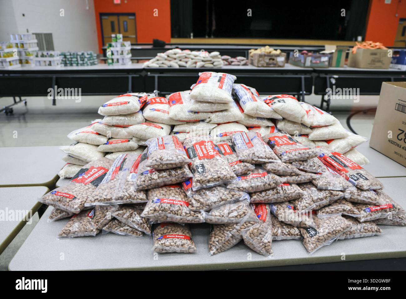 Phoenix, USA. 01st Nov, 2025. Food to be distributed is set up at different  stations for the Neighbor to Neighbor: Food for Every AZ Family community  food distribution event held at Solano