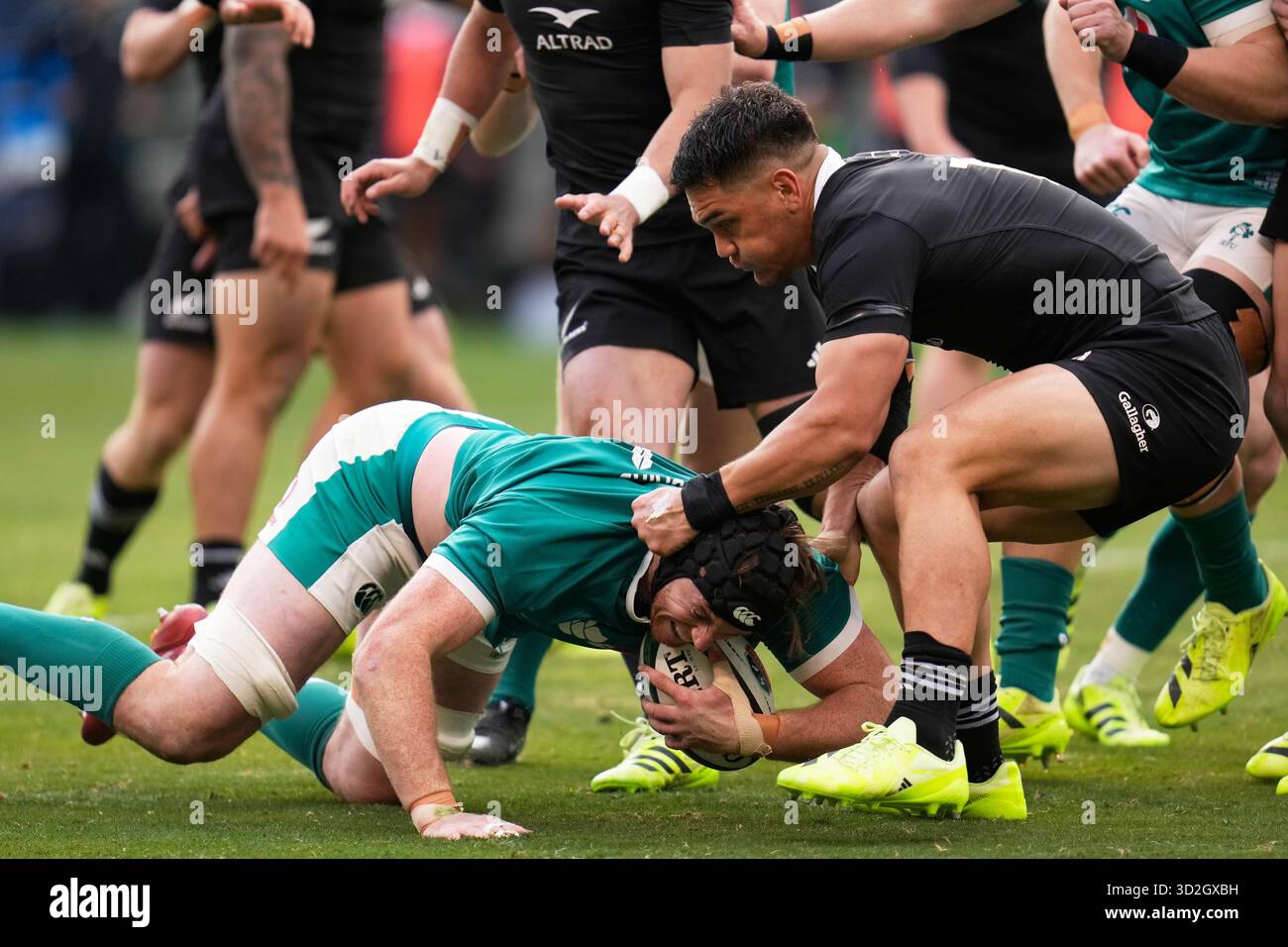 New Zealand's Quinn Tupaea, right, tackles Ireland's Ryan Baird during ...