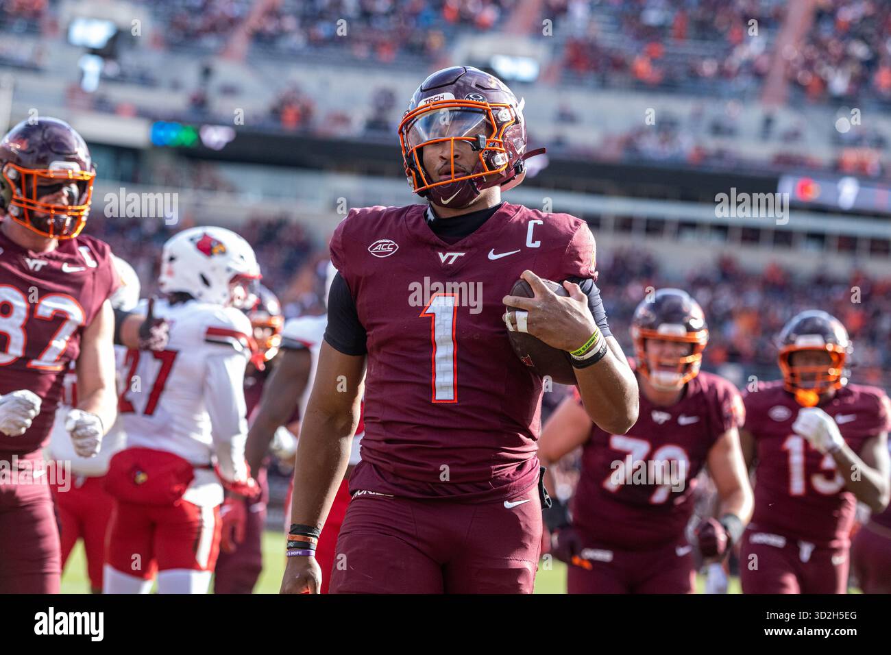 Virginia Tech quarterback Kyron Drones (1) runs in for a touchdown ...