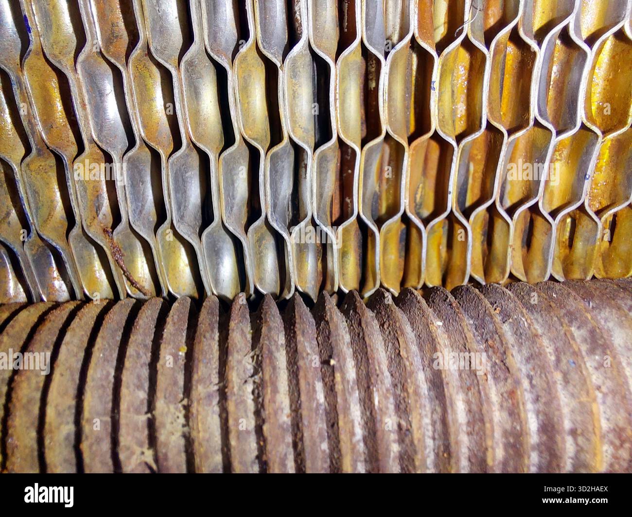 A close-up view shows the intricate design of a plate heat exchanger ...