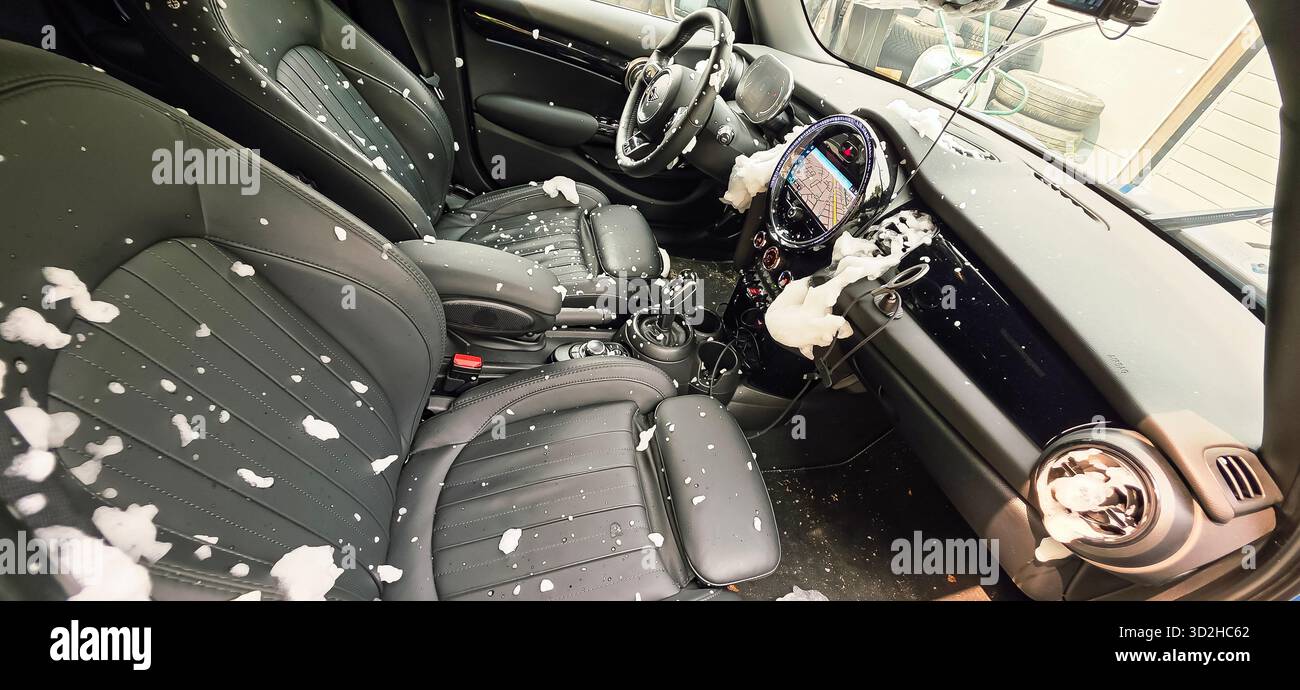 Berlin, Germany - June 08, 2025: . Car interior shows foam and debris scattered on seats and dashboard - Smartphone Captured Stock Image