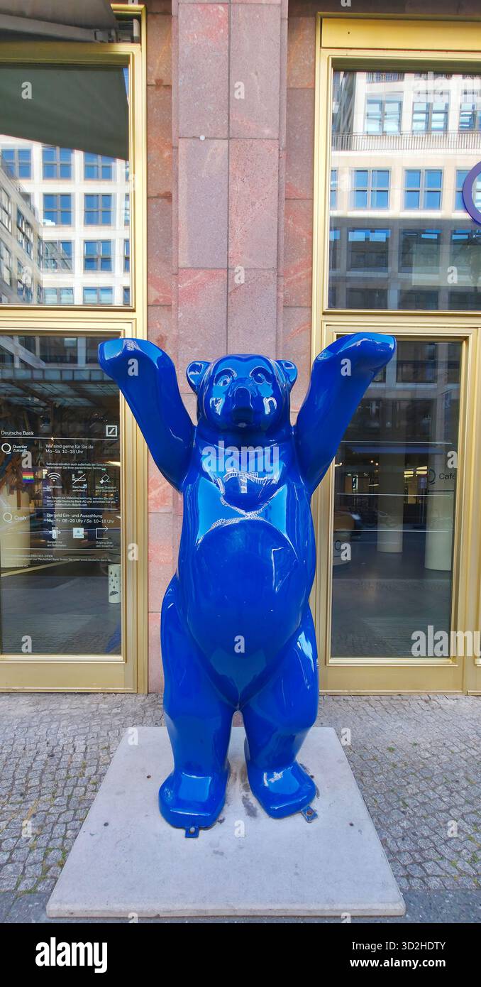 Berlin, Germany - July 03, 2025: . Blue bear statue stands proudly in urban area with modern glass buildings surrounding it - Smartphone Captured Stock Image