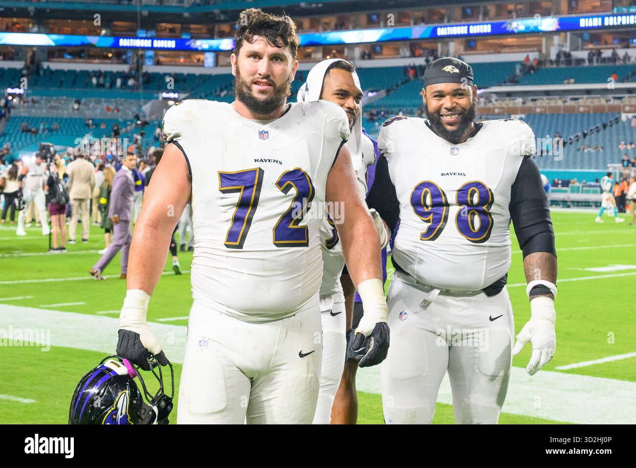 Baltimore Ravens guard Andrew Vorhees (72) and defensive lineman Travis ...
