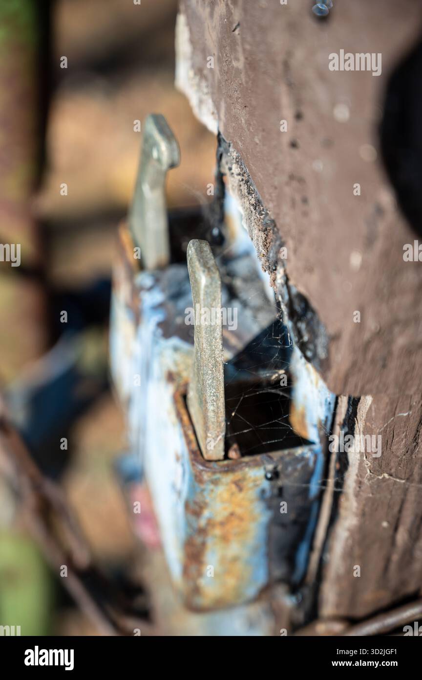 Rusted rural gate latch on paddock fence gate Stock Photo