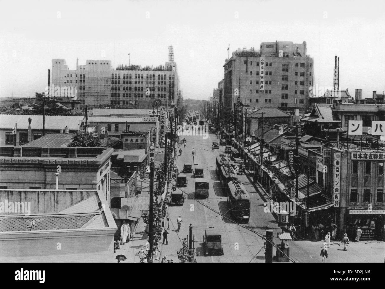 Vintage photo of Mitsukoshi and Isetan along Shinjuku Street