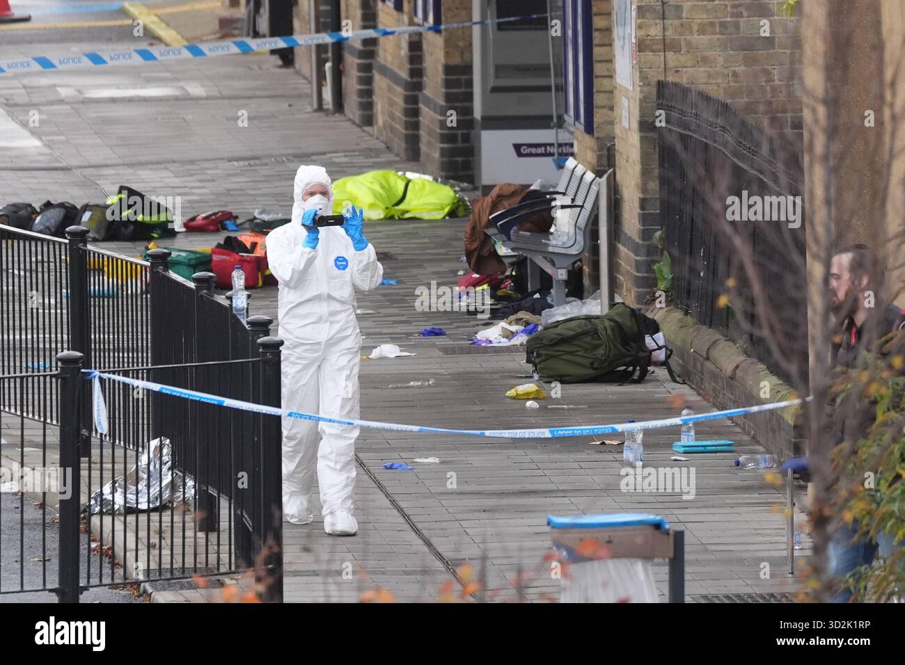 Forensic investigators at Huntingdon train station in Cambridgeshire ...