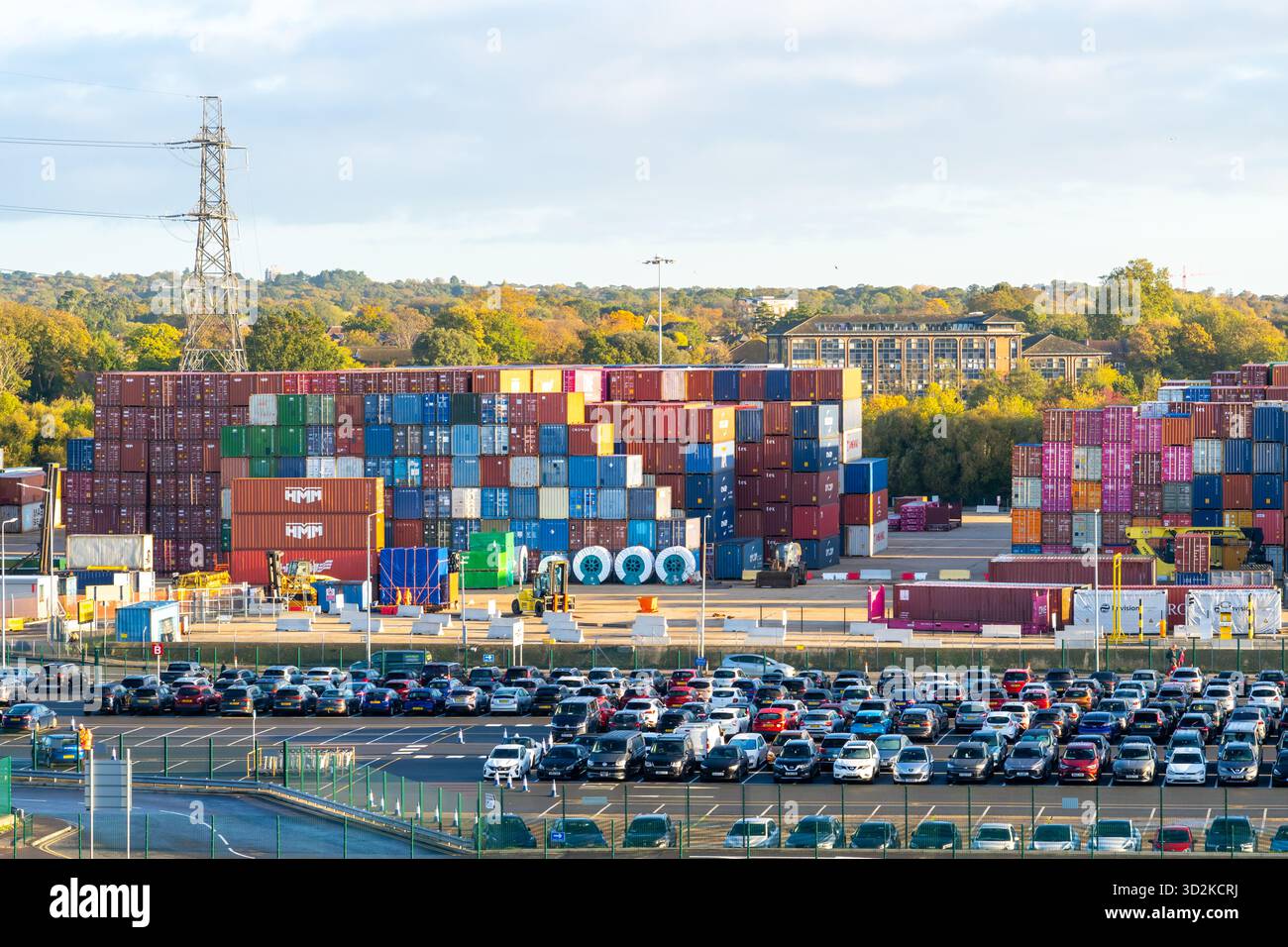 Colourful shipping containers stacked on top of each other at the container port in Southampton, Hampshire, England. Stock Photo