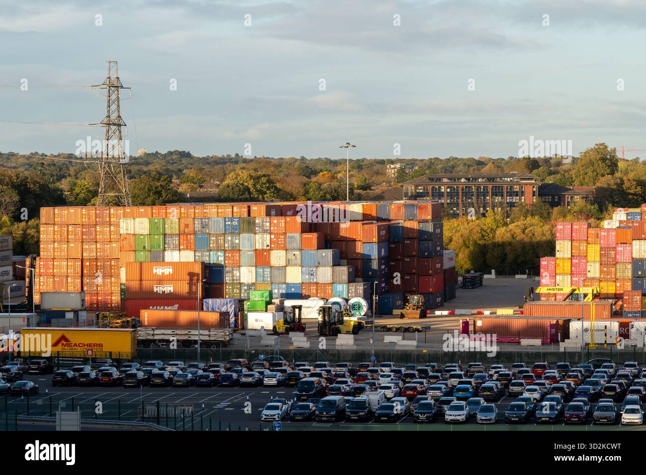 Colourful shipping containers stacked on top of each other at the container port in Southampton, Hampshire, England. Stock Photo