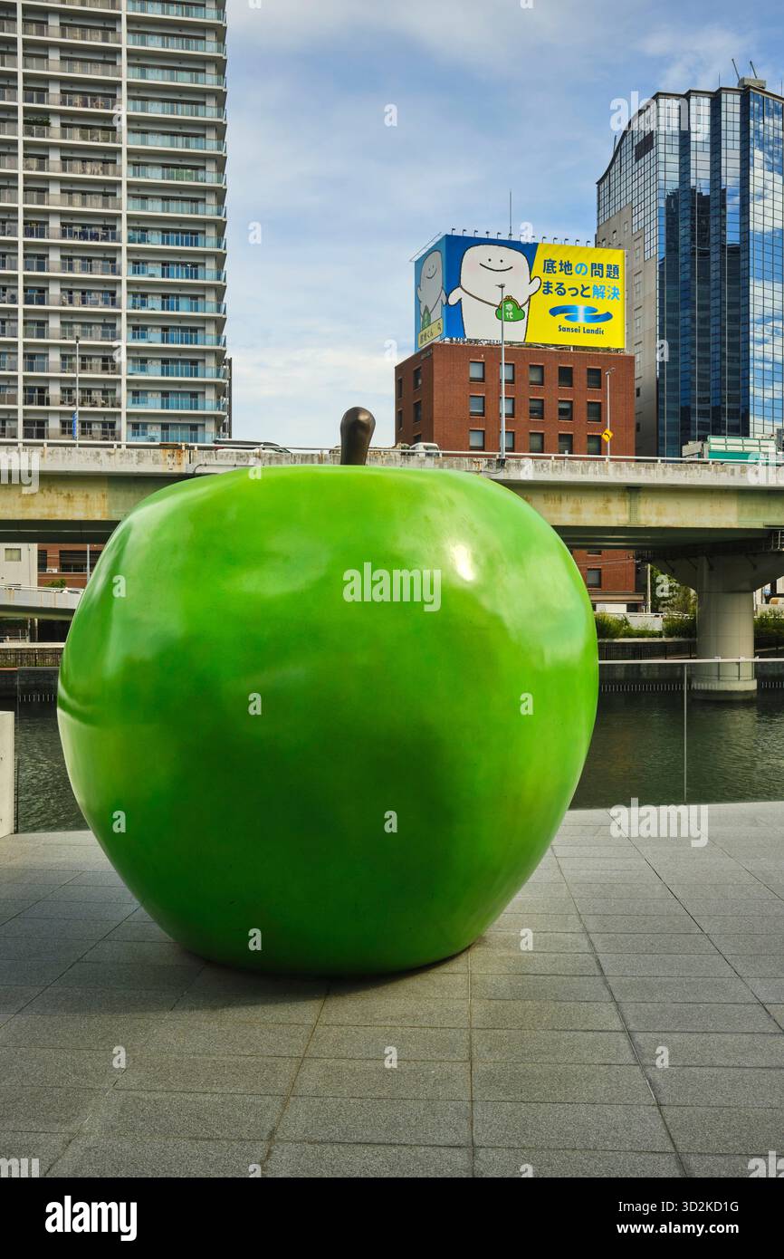A green apple sculpture titled “Youth” on the terrace of the