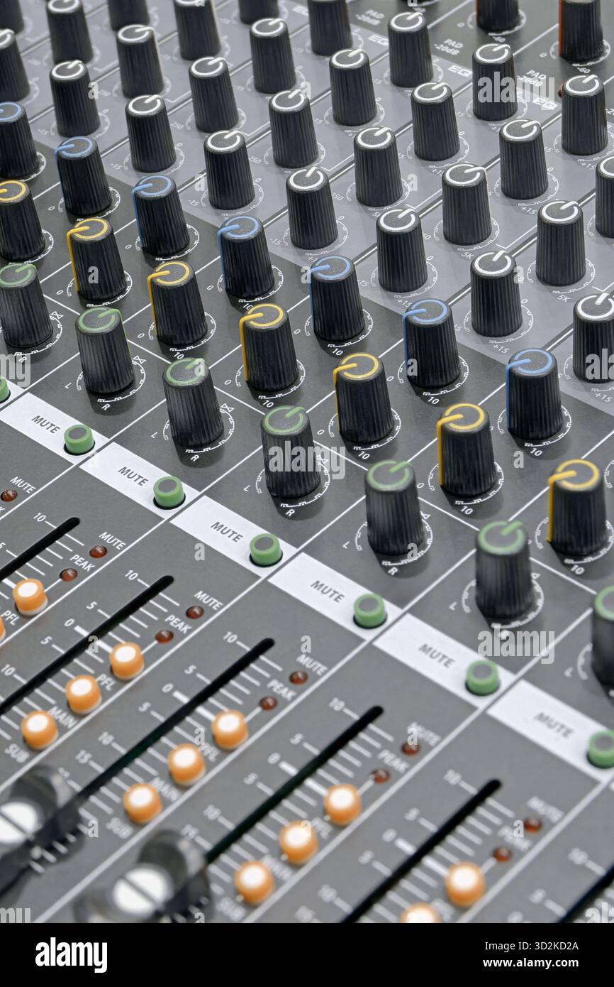 Generic audio mixing console, close up shot, abstract technology background Stock Photo