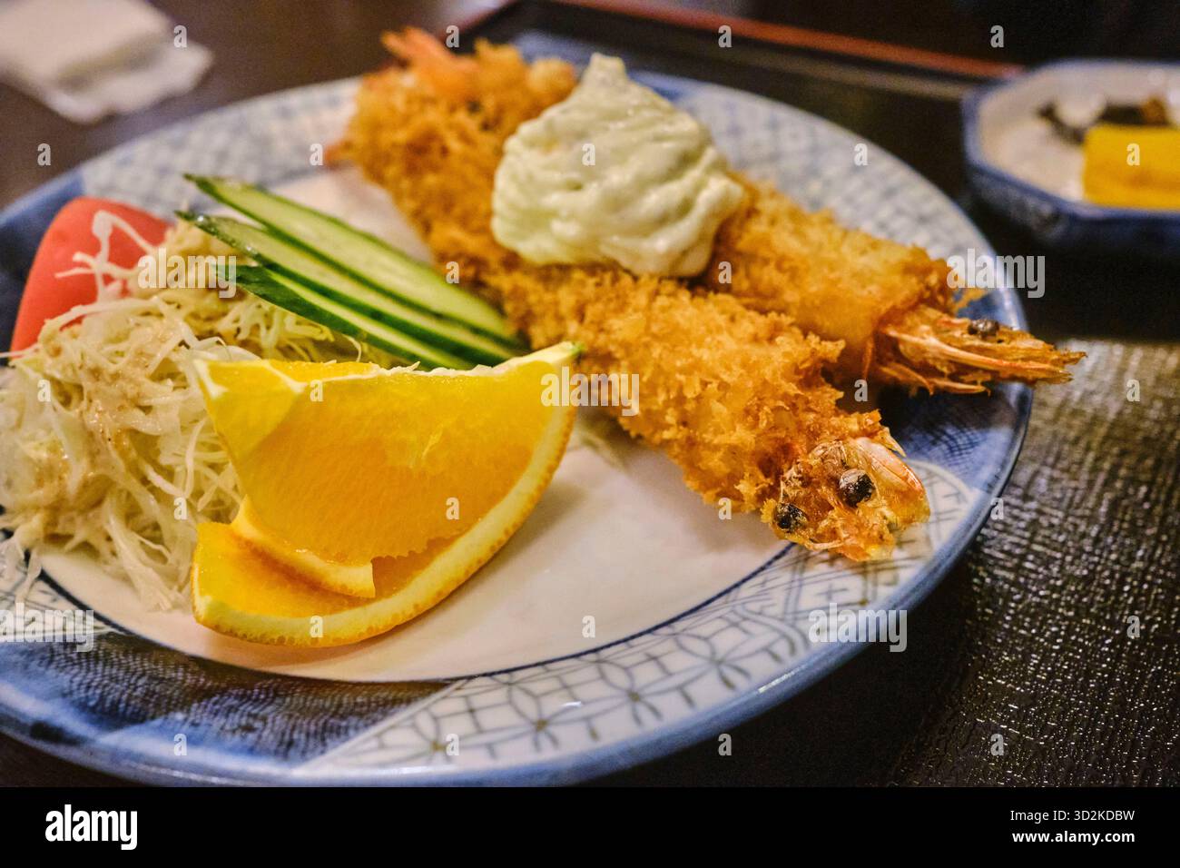 Two pieces of deep fried prawn tempura on a plate, Japan Stock Photo