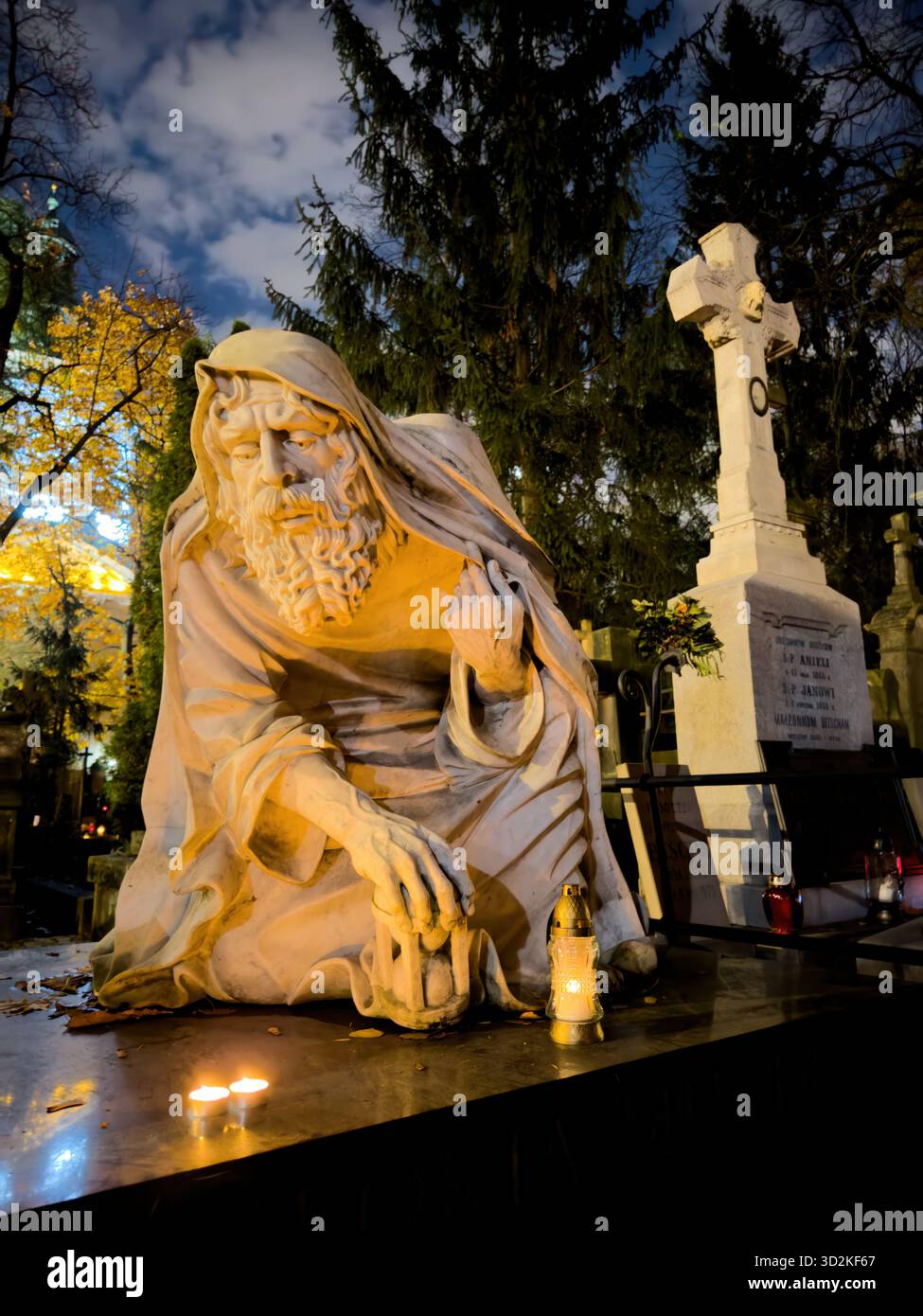 All Souls Day candles glowing among graves symbolize remembrance, spirituality, and eternal love. Memorial scene honoring deceased with flowers - Smartphone Captured Stock Image