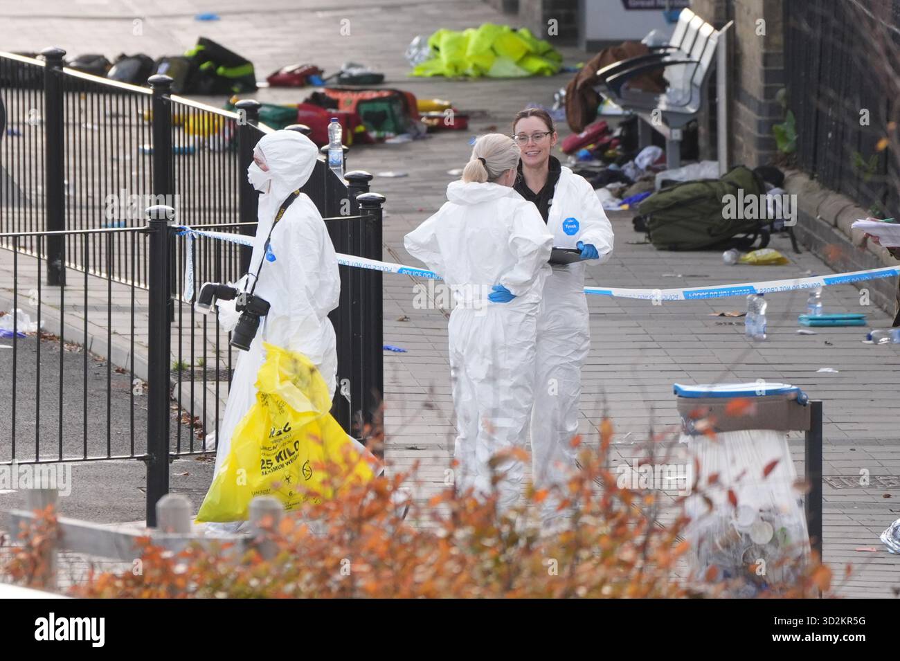 Forensic investigators at Huntingdon train station in Cambridgeshire ...