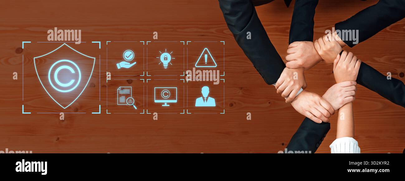 A top-down view of diverse hands joining together symbolizes teamwork ...