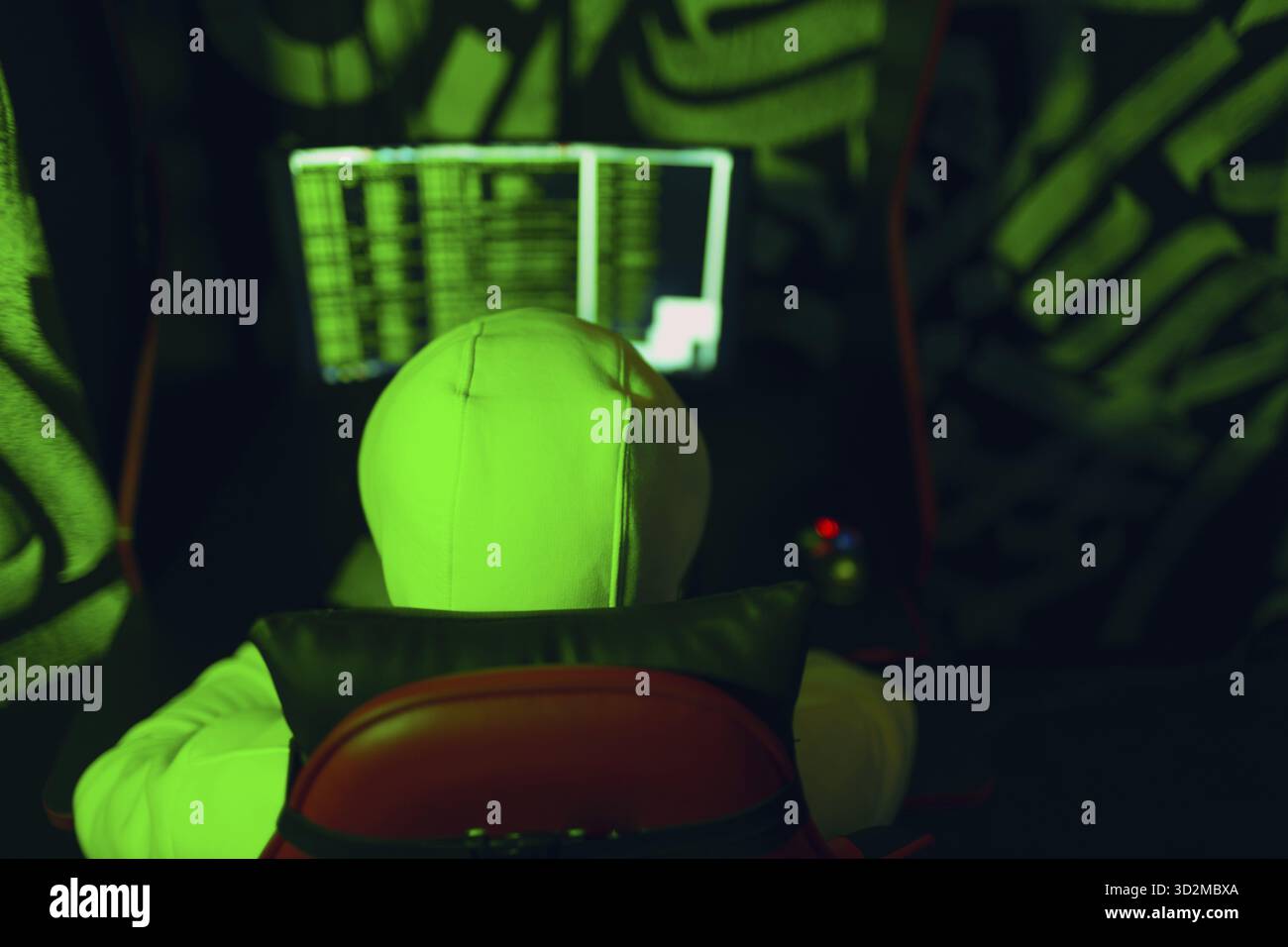 Hacker using computer malware software and hacking binary code green ...