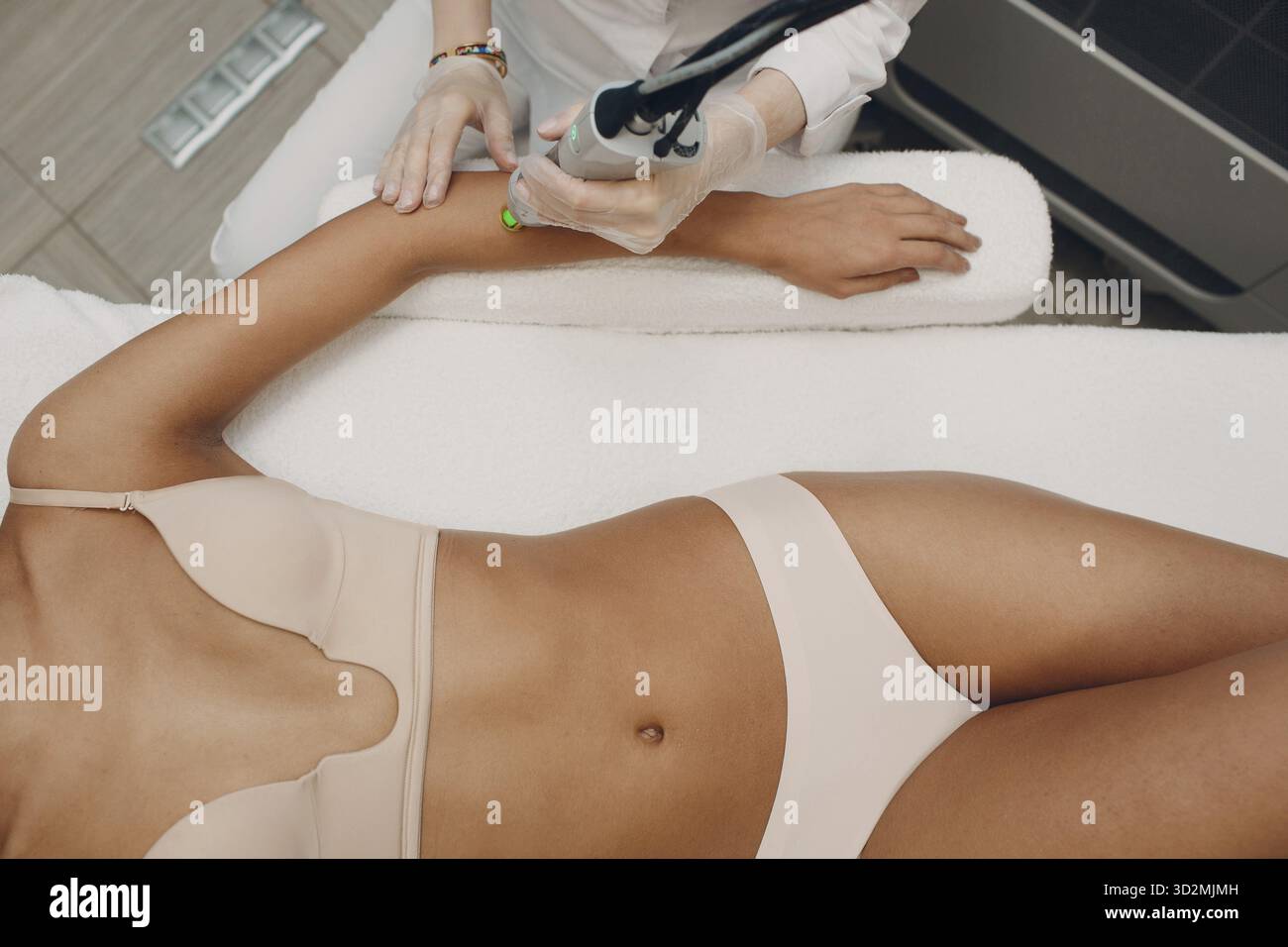 Hands Laser epilation and cosmetology. Hair removal cosmetology procedure. Laser epilation and cosmetology. Cosmetology and SPA concept Stock Photo