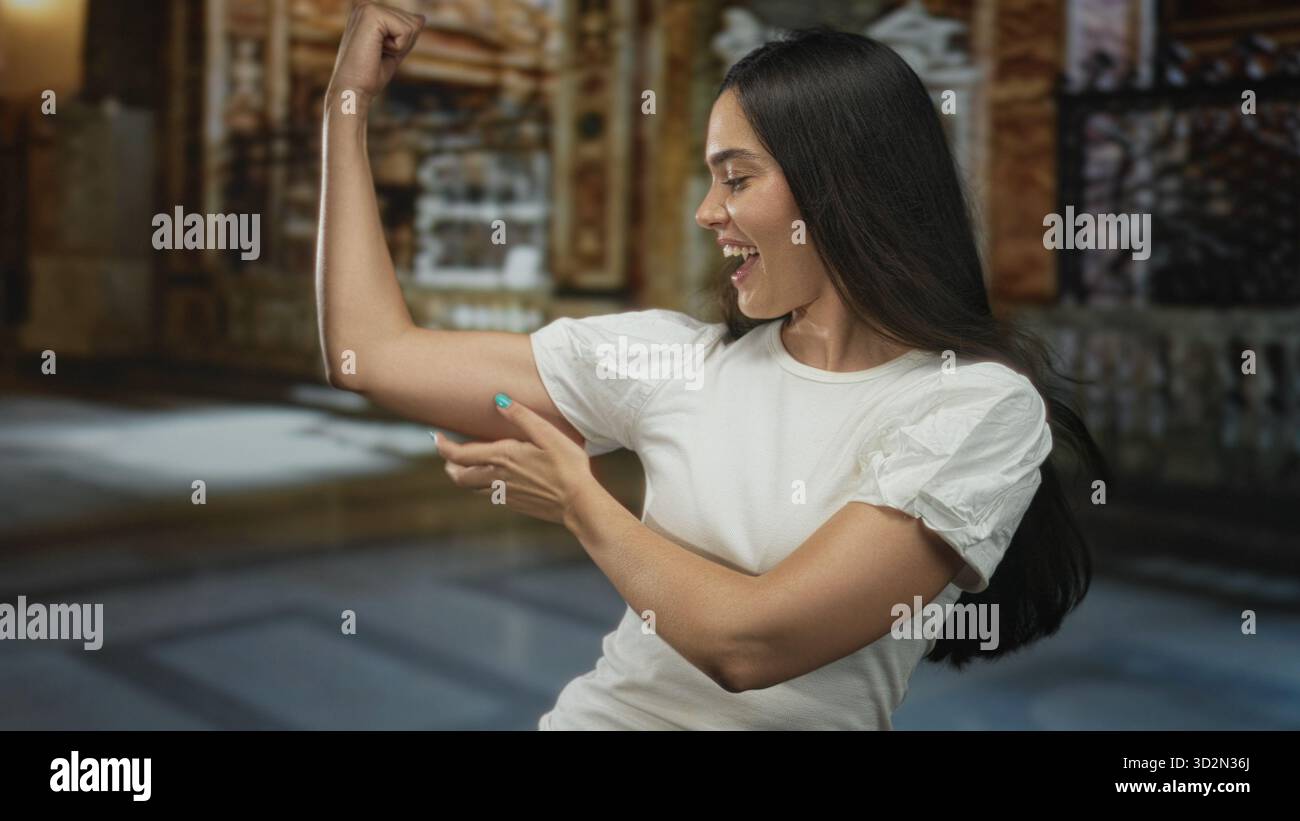 Woman flexes bicep muscle in ornate catholic church interior and points ...
