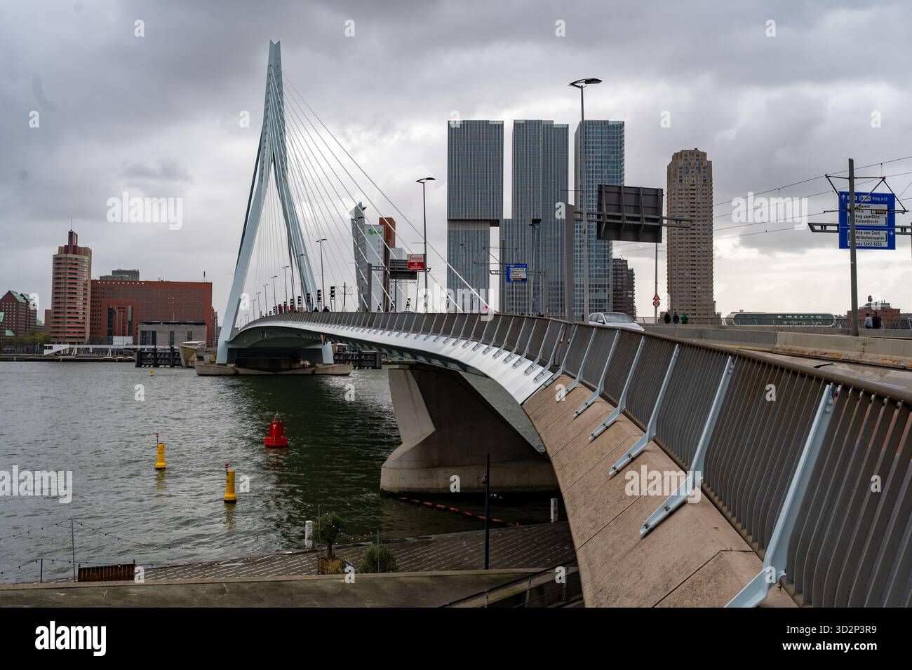 Erasmus Bridge in Rotterdam with modern skyline on cloudy day Stock ...