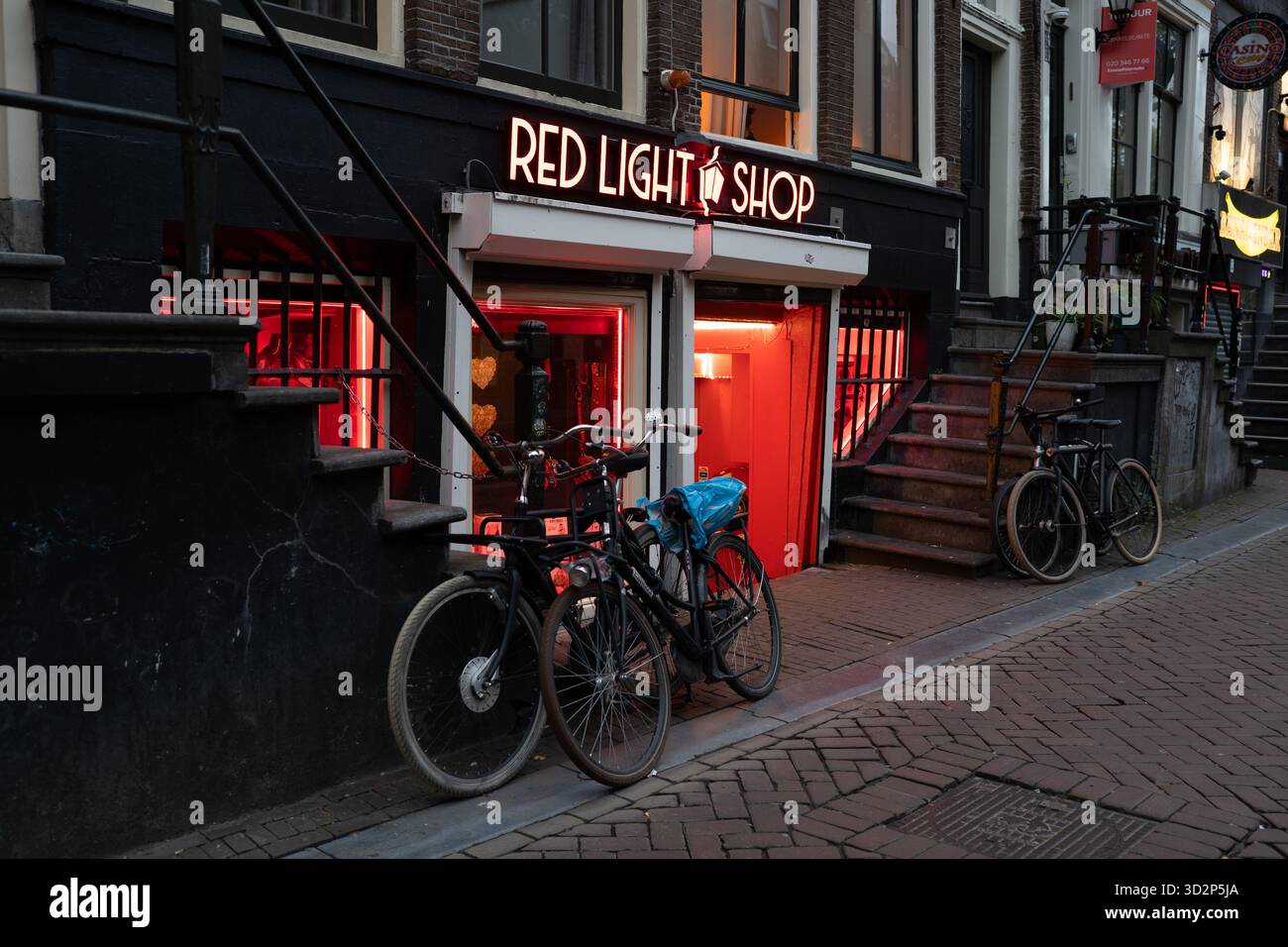 Red Light Shops Red Light Shop entrance with bicycles in Amsterdam Stock Photo - Alamy