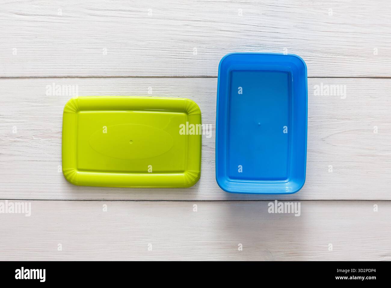 Empty plastic lunch boxes on white wood, top view Stock Photo