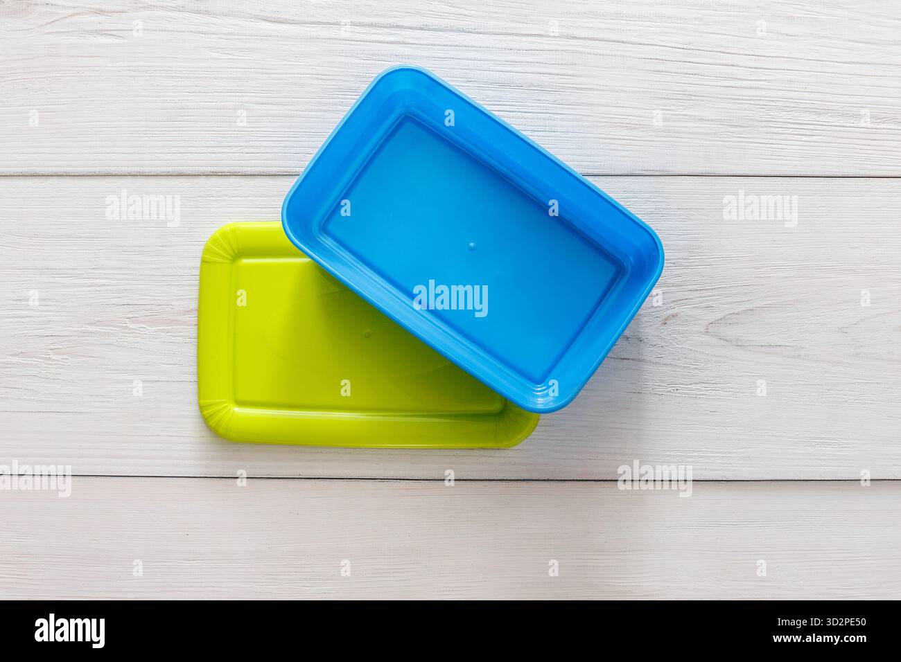 Empty plastic lunch boxes on white wood, top view Stock Photo