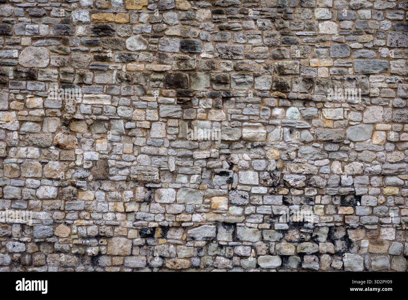 Old British Stone Wall Texture, Rustic Weathered Stone Background Stock Photo