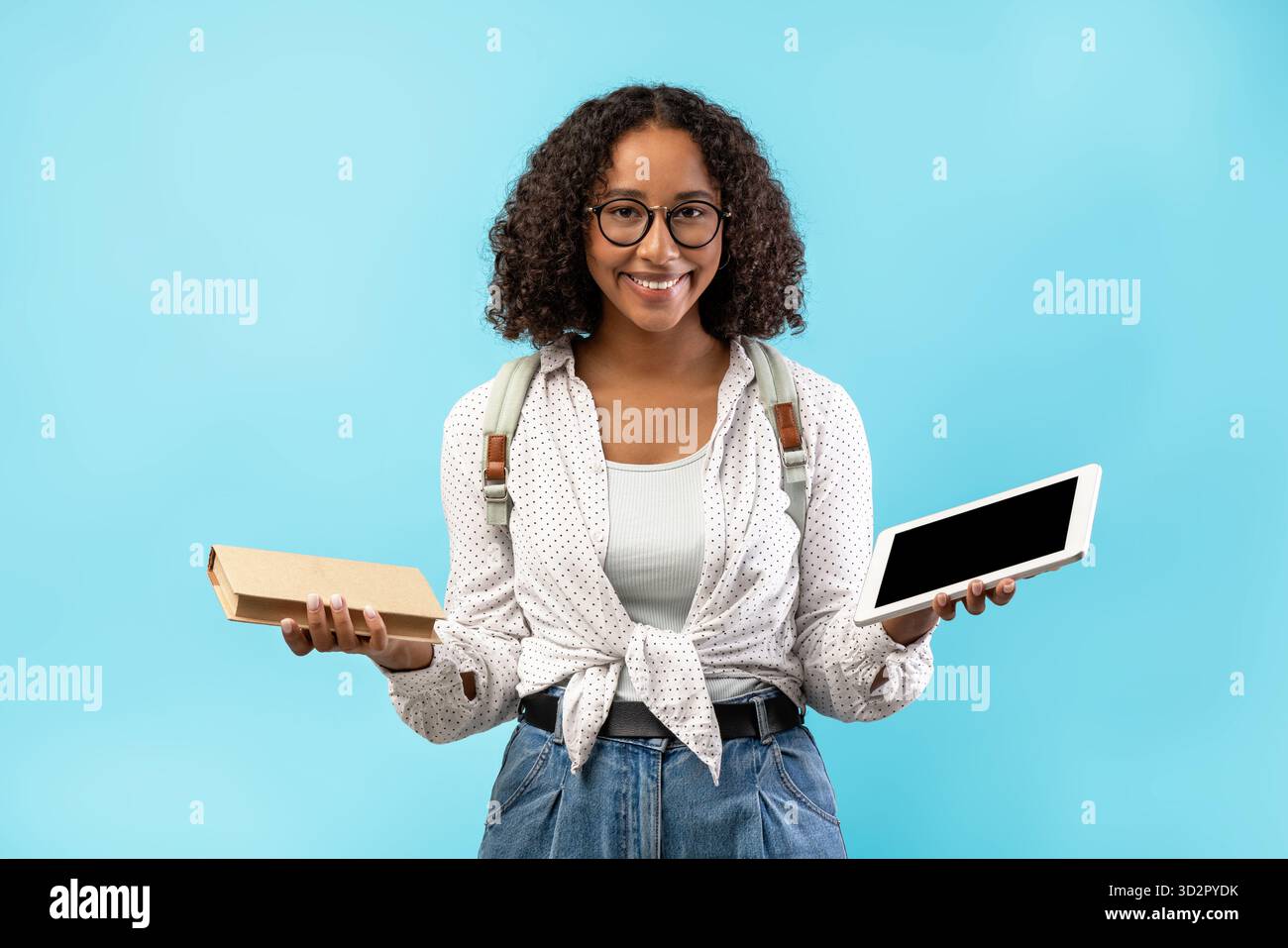Exploring Online Education and Offline Studies With a Smiling Female Student Stock Photo