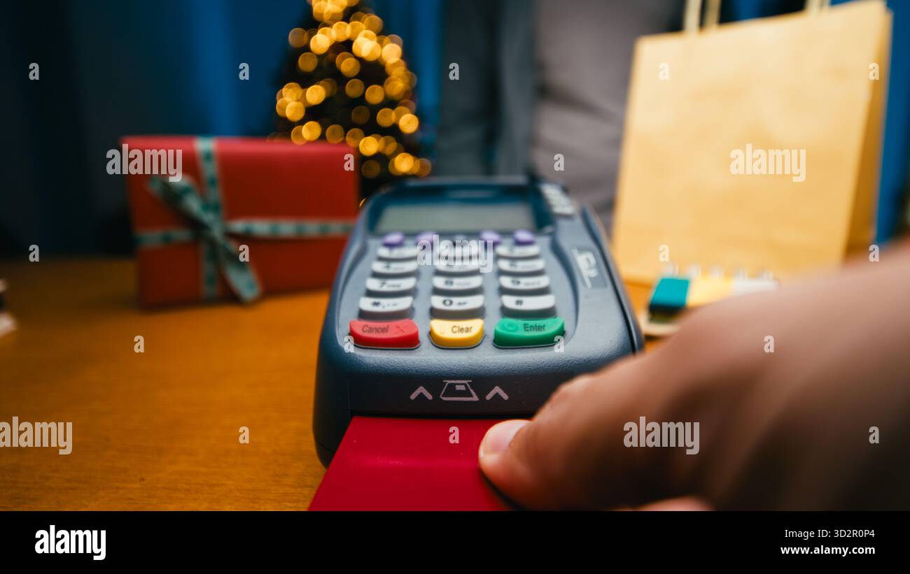 Bank Card Inside Hand Inserting The Red Credit Card Inside The Terminal Stock Photo - Alamy