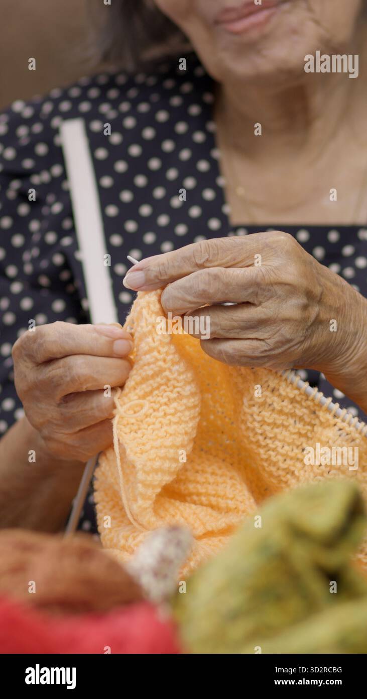 Elderly woman knitting for protect dementia and memory loss Stock Photo ...