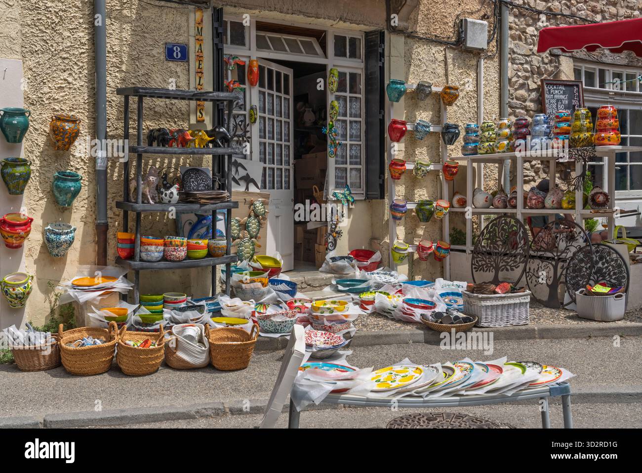 Shops along a street in the village of Vaison-la-Romaine, Drome, Provence, France, Europe. Stock Photo