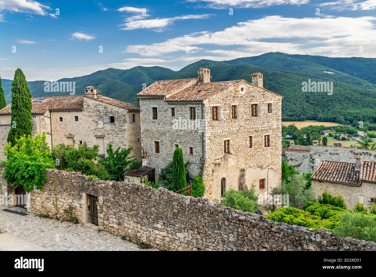 The Chateau and restored stone buildings in the medieval village of Le Poet-Laval, Drome, Provence, France, Europe. Stock Photo