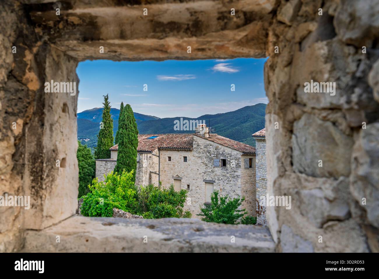 The Chateau and restored stone buildings in the medieval village of Le Poet-Laval, Drome, Provence, France, Europe. Stock Photo