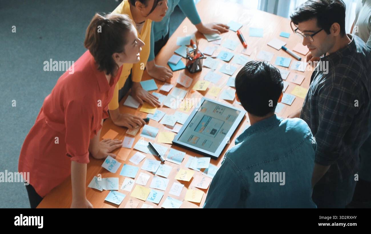 Top view of skilled programmer brainstorming idea about mobile phone interface while develop app development by using wireframe prototype. Web designe Stock Photo