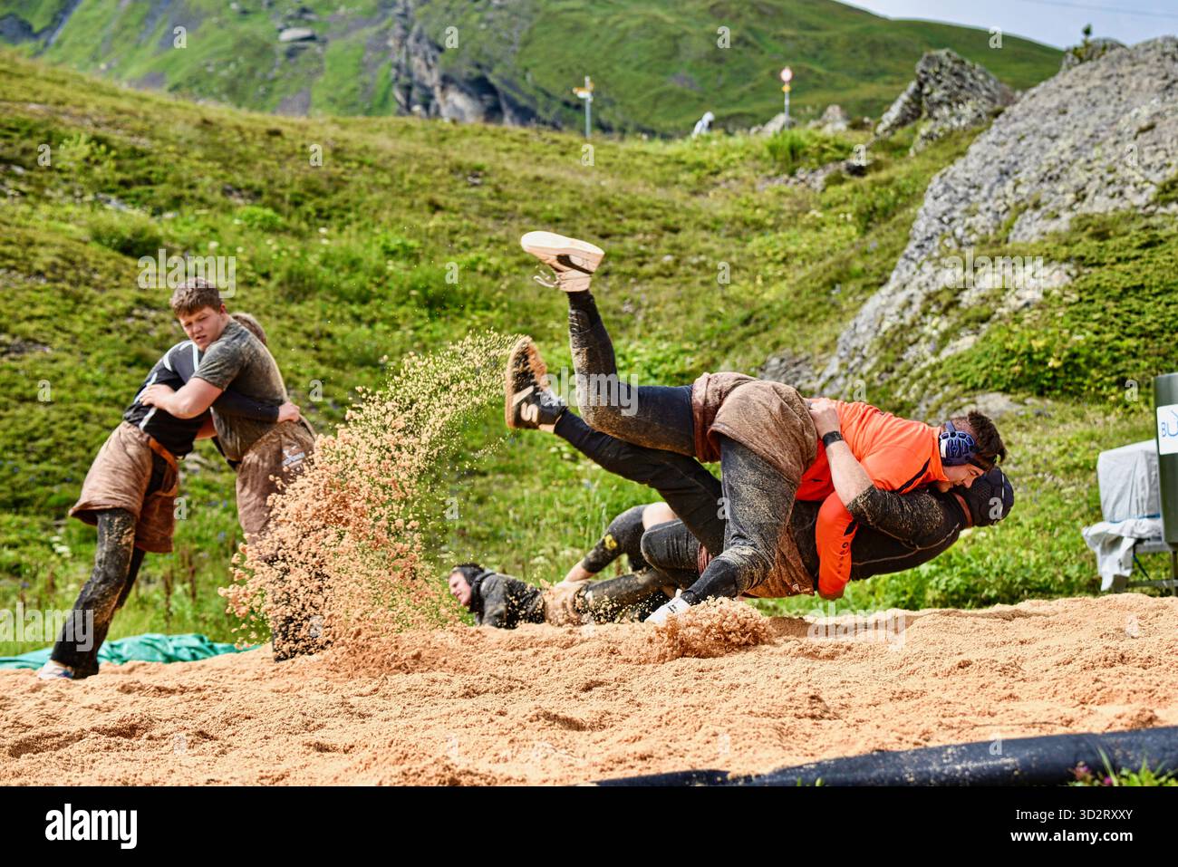 Swiss folk wrestling, Schwingen, being practiced outside by big strong men wearing special leather shorts swinging opponent, Grindelwald, Switzerland Stock Photo