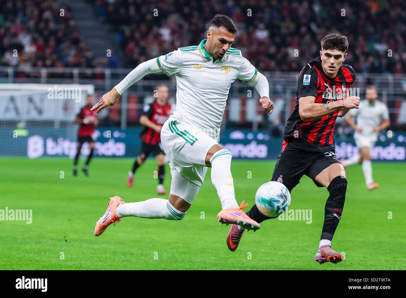 (L-R) Zeki Celik of AS Roma competes for the ball with Davide ...