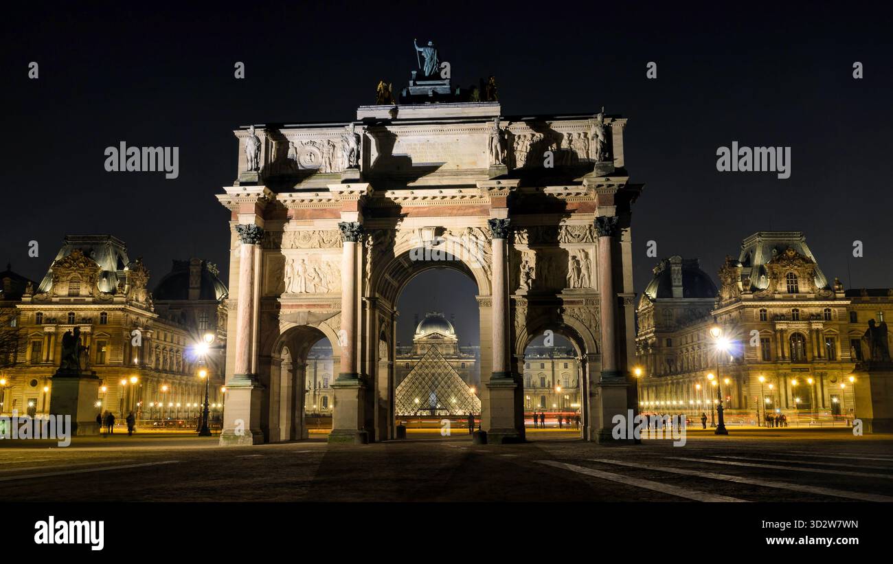 The Arc de Triomphe du Carrousel located in the Place du Carrousel, in font of the Louvre museum and the pyramid. Stock Photo