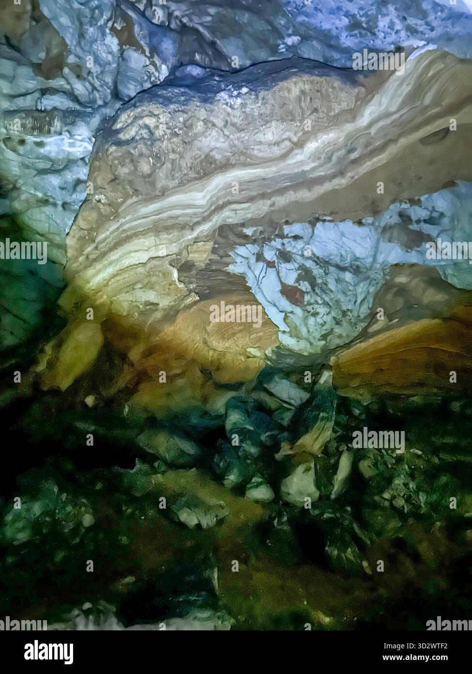 Stunning natural rock formations inside the Ice Cave in Uvac Canyon, Serbia, showcasing layered limestone and mineral textures under cave lighting. - Smartphone Captured Stock Image
