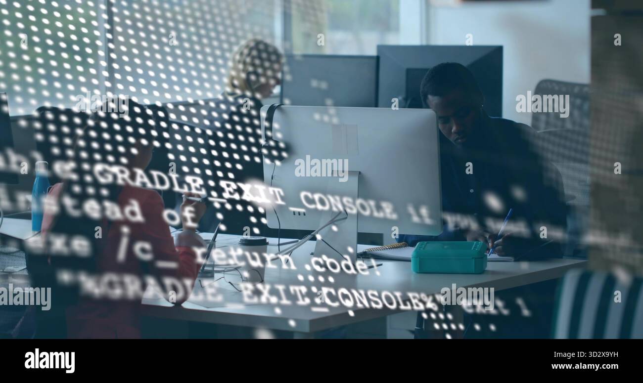 Typing and note taking software team collaborating in open office with code reflections on monitors Stock Photo