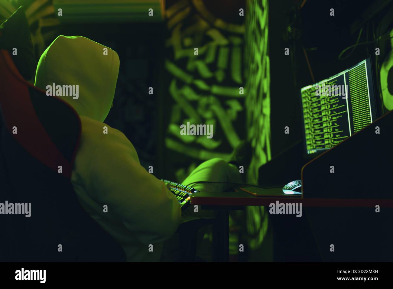 Hacker using computer malware software and hacking binary code green digital interface Stock Photo
