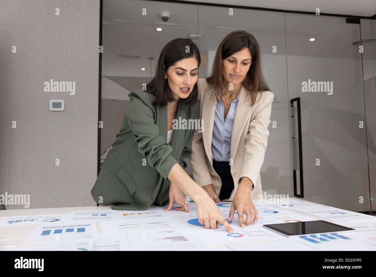 Two diverse female analysts working on project marketing strategy Stock Photo