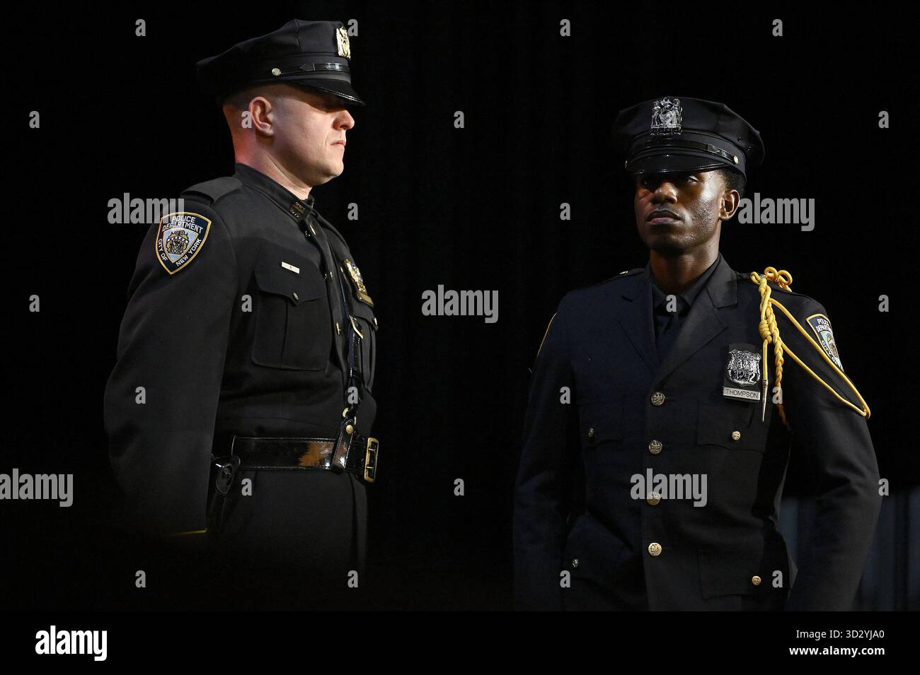 NYPD Officer Bryce Thompson walks on stage to receive a recognition ...