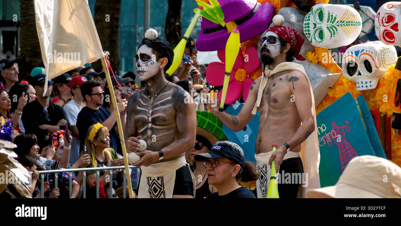 Jugglers take part in a Day of the Dead parade in Mexico City, Mexico Stock Photo