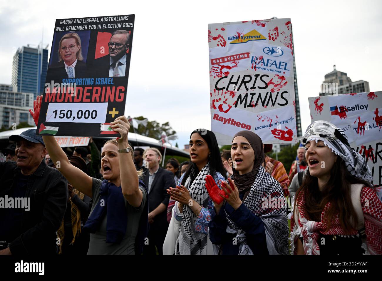 Protesters hold placards during and attempted blockade by the Palestine ...