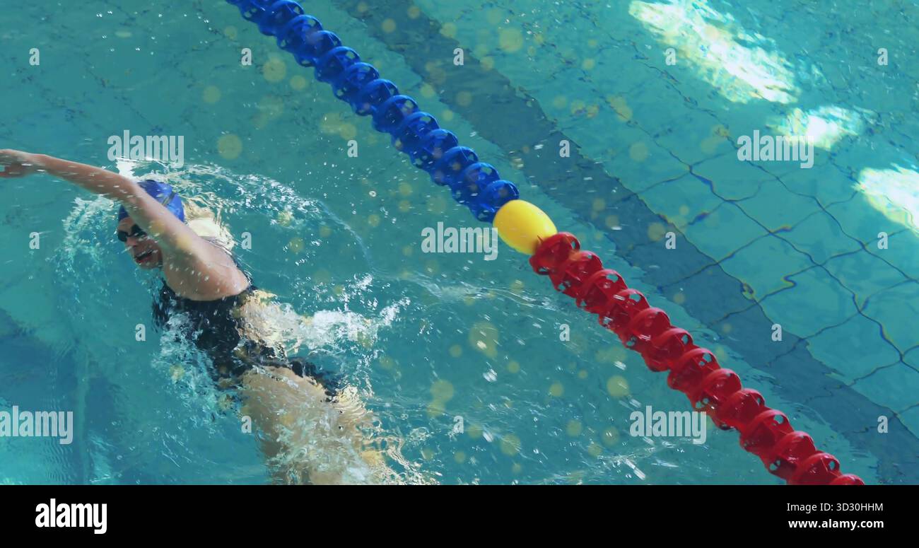 Swimming athlete wearing swimsuit performing crawl in pool lane with ...