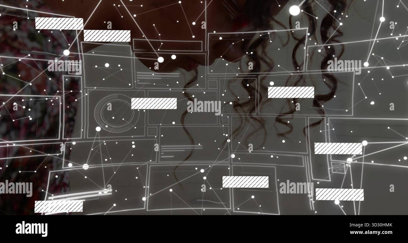 Analyzing adult female using digital network overlay at desk, with floating data interface elements Stock Photo