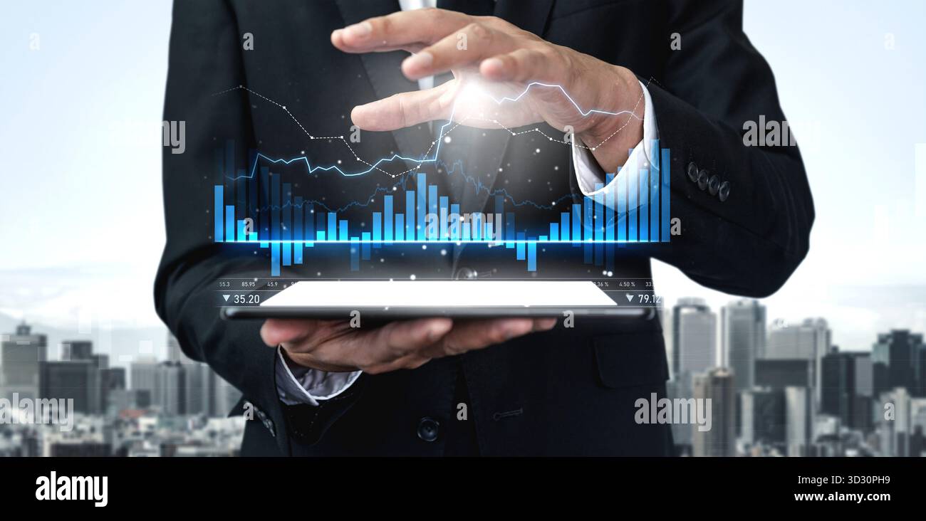 A businessman interacts with a high-tech tablet displaying dynamic financial graphs against an urban skyline, illustrating modern data analysis for pr Stock Photo