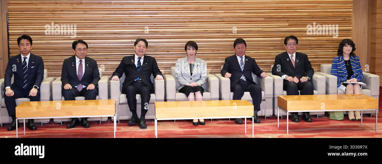 Japanese Prime Minister Sanae Takaichi (C) attends a cabinet meeting at ...